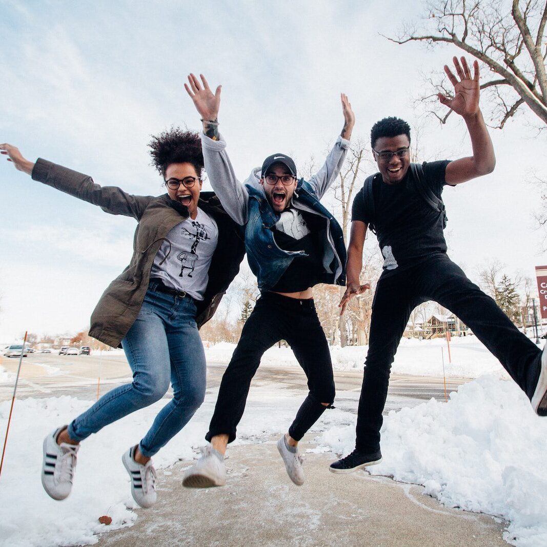 photo of three people jumping joyfully outside in the snow for Ministry Architects Volunteer Accelerator